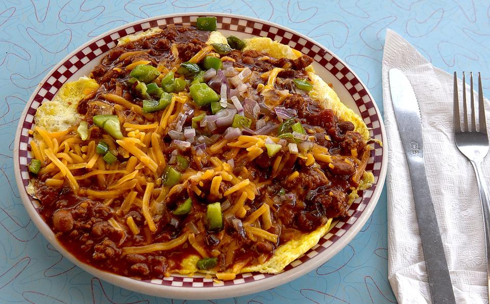 The famous meal at Broadway Diner called The Stretch features hash browns, scrambled eggs, chili, cheese, grilled peppers and onions. The meal was named after Kathy Folsom Hauswirth around 1972.