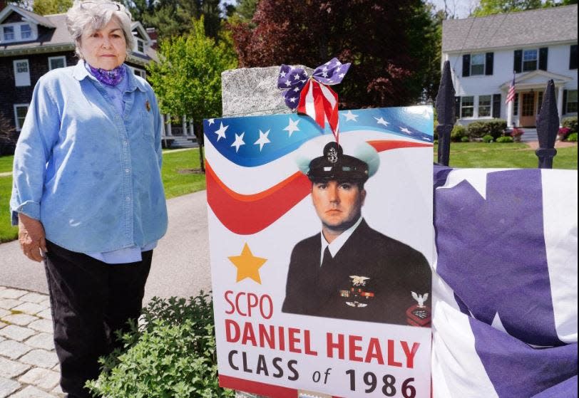 Gold Star mother Natalie Healy stands with a poster memorializing her son, Daniel, a Navy SEAL killed in Afghanistan in 2005. The Dan Healy Memorial 5K road race takes place Sunday at Exeter's Recreation Park. FILE