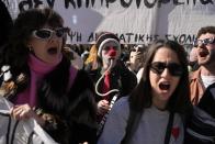 Students from drama and arts schools shout slogans during a protest outside parliament in Athens, Greece on Thursday, Feb. 2, 2023. Performing artists and arts students are striking for a second day, closing theatres, halting television shoots and disrupting art school classes, to protest charges in the qualification system of civil service jobs. (AP Photo/Thanassis Stavrakis)