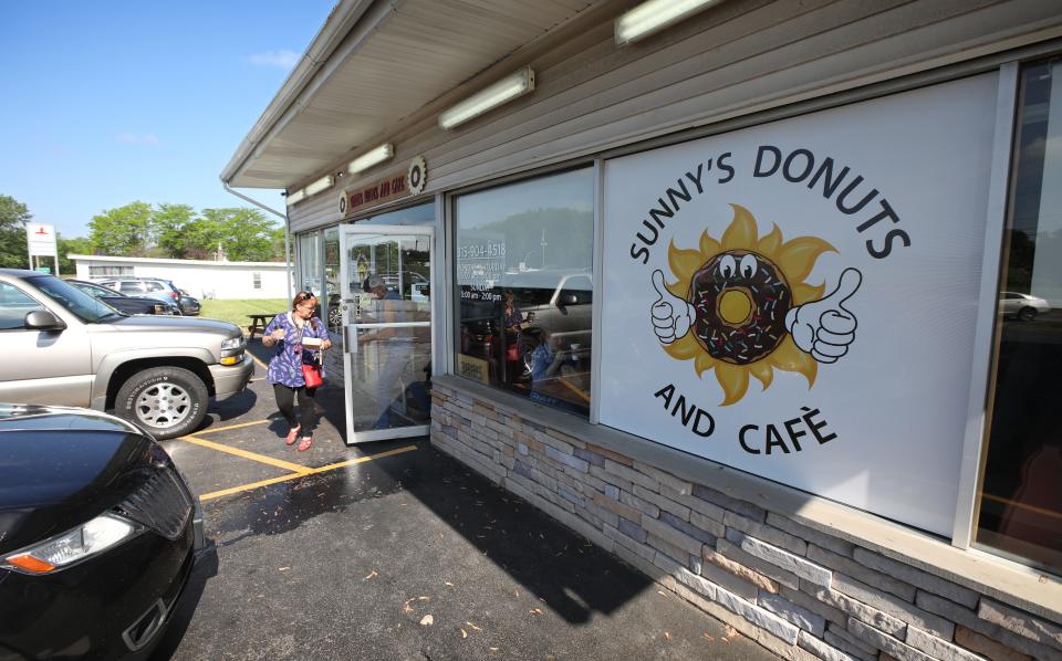A steady stream of customers comes and goes at Sunny's Donuts and Café, 3885 NY-104 in Williamson Friday, June 4, 2021.