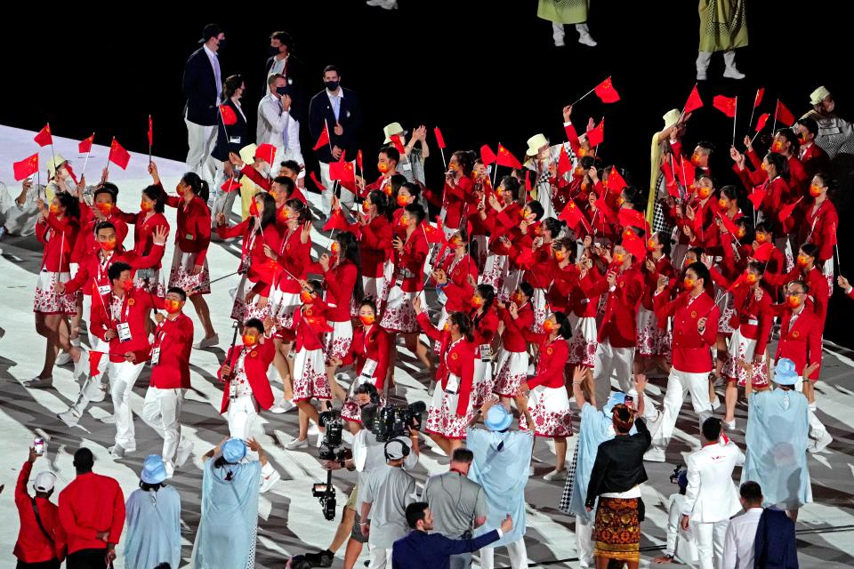 The delegation from China marches during the opening ceremony for the Tokyo 2020 Olympic Summer Games at Olympic Stadium. The Games were held in 2021 due to the pandemic.