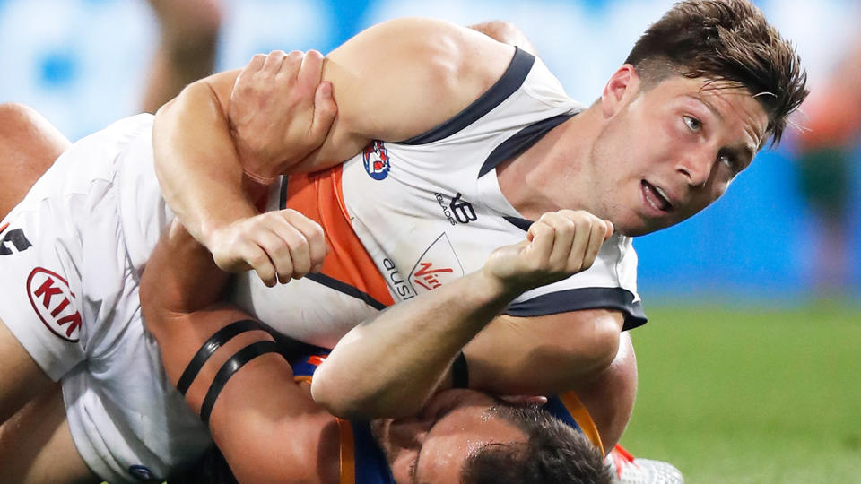 Toby Greene, pictured during the Giants' clash with Brisbane, has reportedly copped a one-week ban.