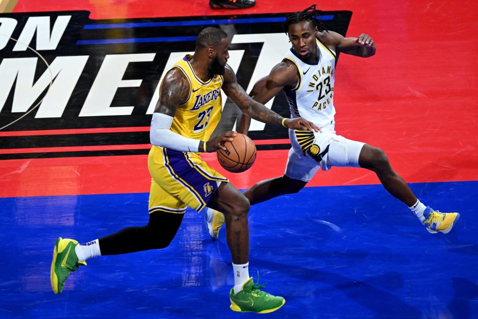 Dec 9, 2023; Las Vegas, Nevada, USA; Los Angeles Lakers forward LeBron James (23) dribbles against Indiana Pacers forward Aaron Nesmith (23) during the fourth quarter of the NBA In-Season Tournament Championship game at T-Mobile Arena. Mandatory Credit: Candice Ward-USA TODAY Sports