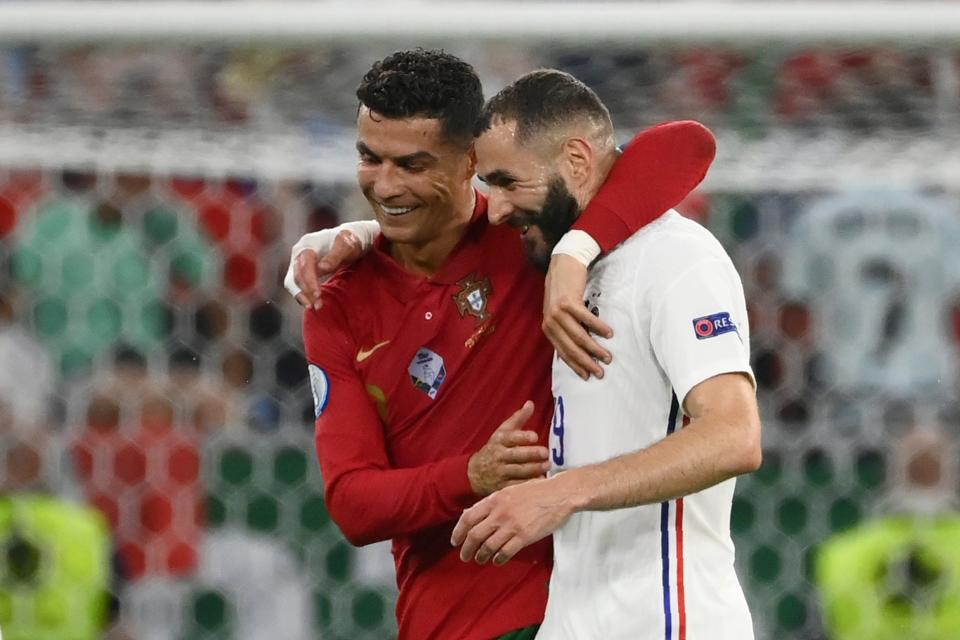 Cristiano Ronaldo and Karim Benzema at half-time (AP)