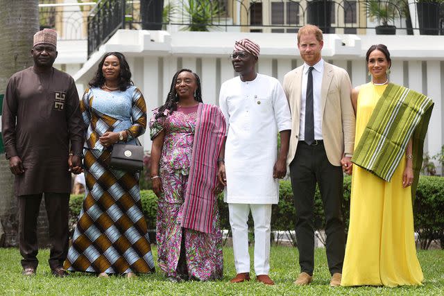 <p>KOLA SULAIMON/AFP via Getty</p> Nigeria Chief of Defense Staff Christopher Musa (L), his wife Lilian Musa (2ndL), Lagos State Governor wife, Ibijoke Sanwo-Olu (3rdL), Lagos State Governor, Babajide Sanwo-Olu (3ndR), Britain's Prince Harry (2ndR), Duke of Sussex, and Britain's Meghan (R), Duchess of Sussex, pose for a photo at the State Governor House in Lagos on May 12, 2024