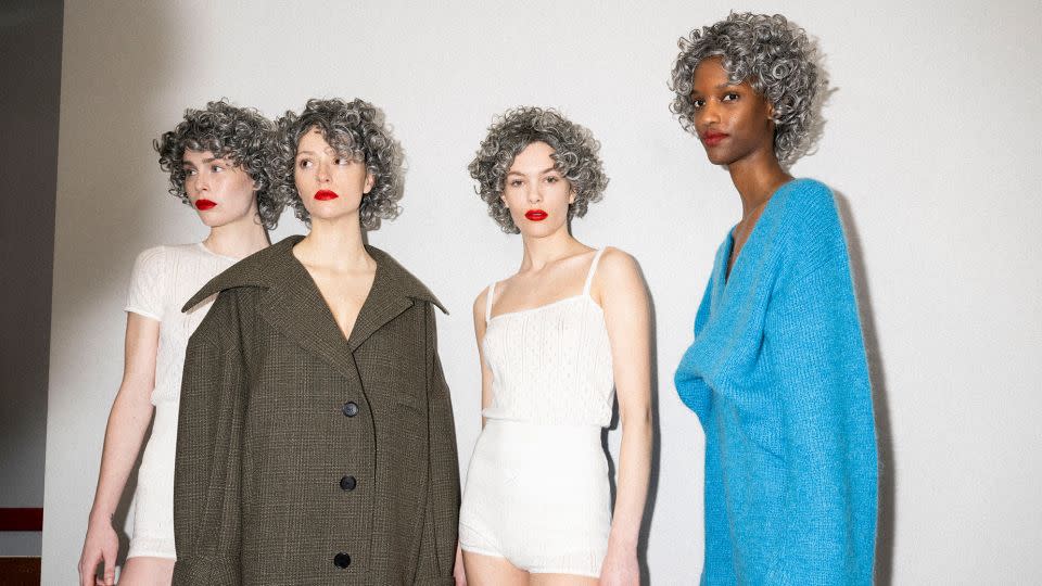 Coiled silver wigs were a mainstay at the JW Anderson show. - JW Anderson