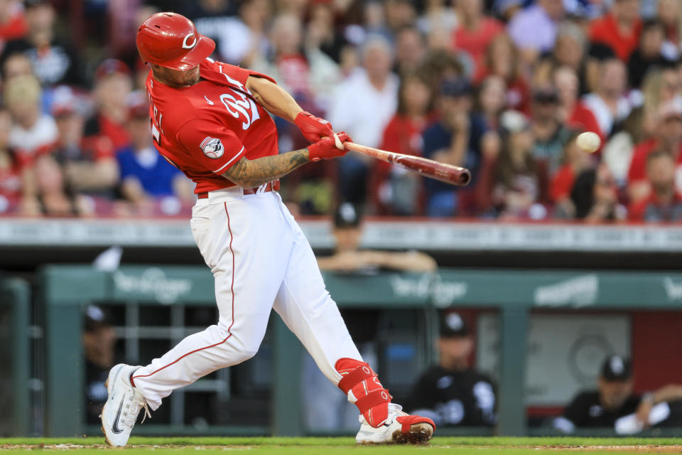 Cincinnati Reds' Nick Senzel hits an RBI-single during the fourth inning of a baseball game against the Chicago White Sox in Cincinnati, Friday, May 5, 2023. (AP Photo/Aaron Doster)