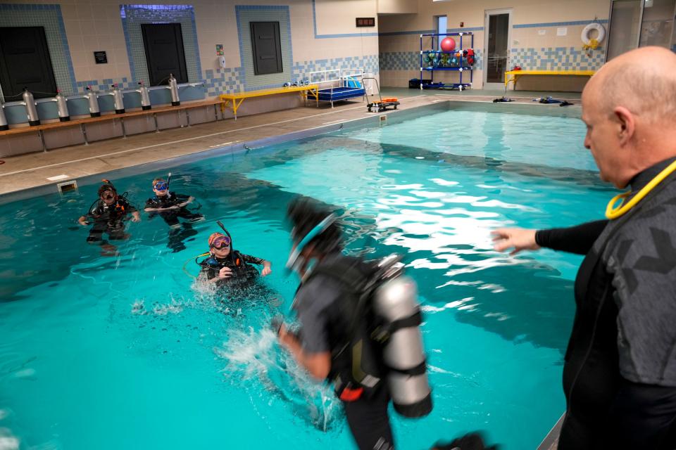 Students take a dive in the scuba diving pool at Aquatic Adventures in Hilliard in April 2023. LifeWise will be moving into the former Aquatic Adventures Ohio building later this year as the religious education organization experiences rapid growth.