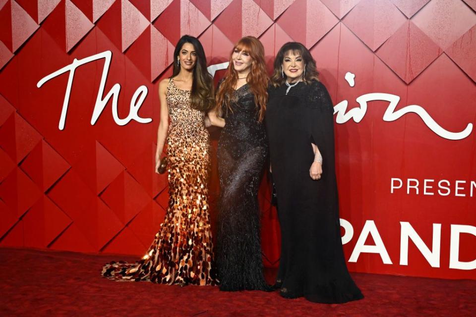london, england december 04 amal clooney, charlotte tilbury and baria alumuddin attend the fashion awards 2023 presented by pandora at the royal albert hall on december 04, 2023 in london, england photo by gareth cattermolegetty images