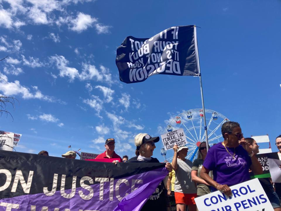 About 100 people gathered in Butoonwood Park on Saturday, July 9, to demonstrate against the Supreme Court's decision to overturn Roe v. Wade. The demonstrators then marched to the New Bedford Public Library.