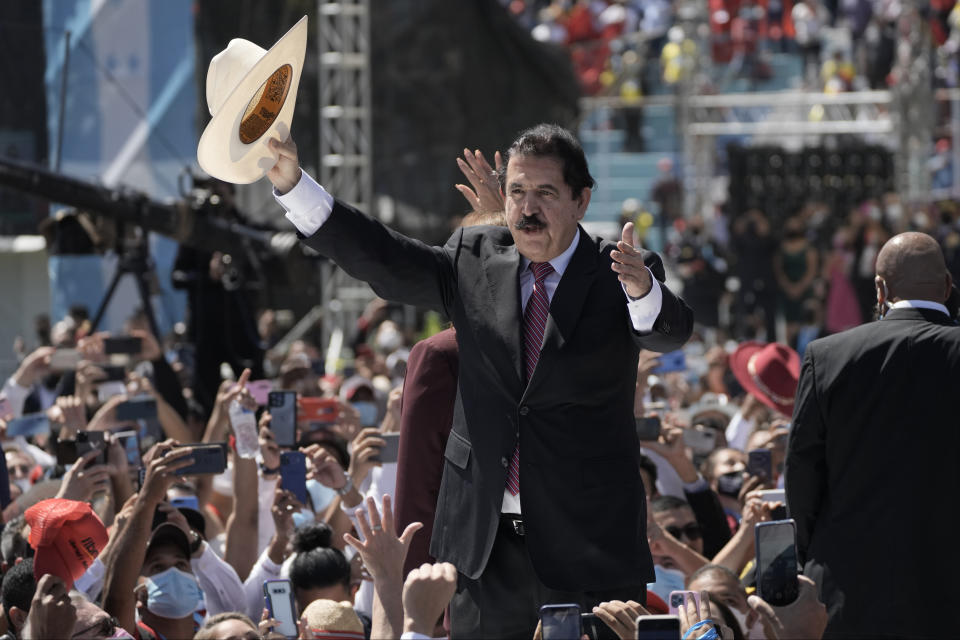 Former Honduran President Manuel Zelaya, who was ousted by a military coup in 2009, greets supporters of his wife, President-elect Xiomara Castro, as they arrive to the National Stadium for her inauguration ceremony, in Tegucigalpa, Honduras, Thursday, Jan. 27, 2022. Castro was sworn in as the country’s first female president Thursday. (AP Photo/Moises Castillo)