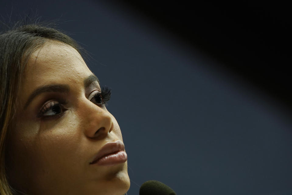 FILE - Brazilian singer Anitta listens to a question during a press conference in Rio de Janeiro, Brazil, July 5, 2019. Anitta released a music video Tuesday, May 14, 2024, depicting rituals of the Afro-Brazilian faith Candomble, sparking some controversy. It is a rare personal offering from the artist, who grew up practicing the religion in Rio de Janeiro’s north zone. (AP Photo/Leo Correa, File)