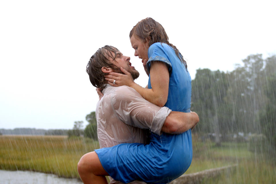 Rachel McAdams and Ryan Gosling embrace passionately in the rain in a scene from the movie, "The Notebook"