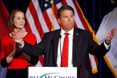 North Carolina Governor Pat McCrory tells supporters that the results of his contest against Democratic challenger Roy Cooper will be contested, while his wife Ann looks on, in Raleigh, North Carolina, U.S. November 9, 2016. REUTERS/Jonathan Drake