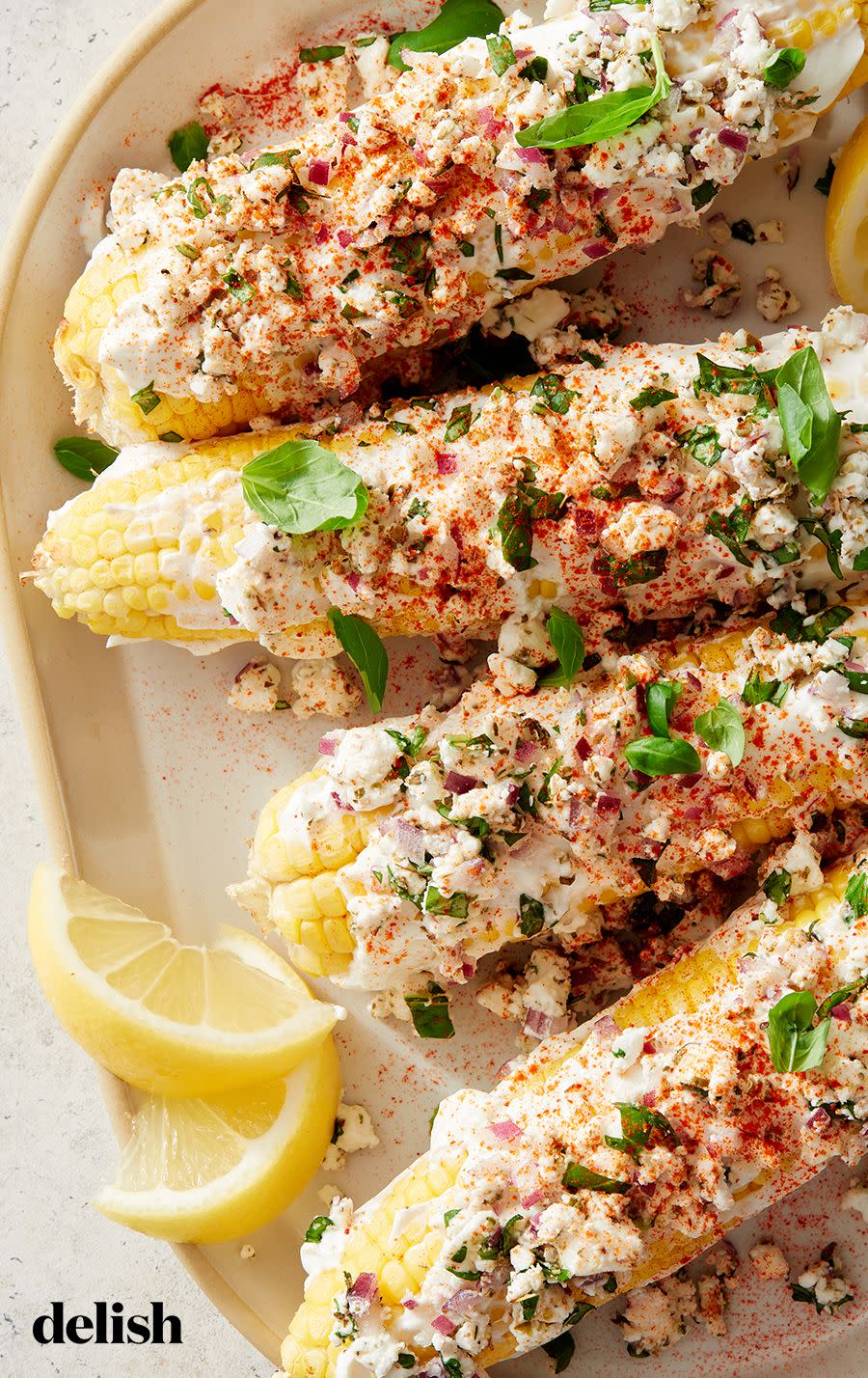 <p><a href="https://www.delish.com/cooking/recipe-ideas/recipes/a47269/mexican-street-corn-elote-recipe/" rel="nofollow noopener" target="_blank" data-ylk="slk:Elote, or Mexican street corn" class="link ">Elote, or Mexican street corn</a>—relies on cotija to keep the toppings in place. Here, we've swapped in Greek yogurt (and feta, oregano, red onion, and basil) for a <a href="https://www.delish.com/cooking/g4016/greek-food-recipes/" rel="nofollow noopener" target="_blank" data-ylk="slk:Greek" class="link ">Greek</a>-inspired version you're going to love.</p><p>Get the <strong><a href="https://www.delish.com/cooking/recipe-ideas/a39740613/air-fryer-corn-on-the-cob-recipe/" rel="nofollow noopener" target="_blank" data-ylk="slk:Air Fryer Corn On The Cob recipe" class="link ">Air Fryer Corn On The Cob recipe</a></strong>.</p>