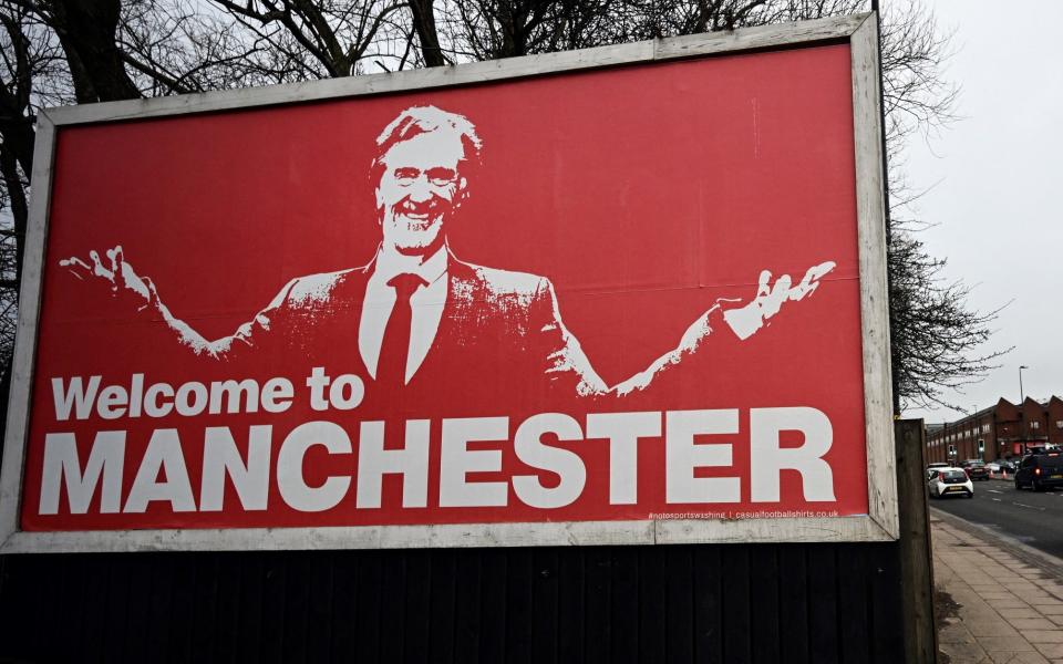 A billboard depicting INEOS chairman and Manchester United shareholder Sir Jim Ratcliffe with the slogan 'Welcome to Manchester' near the Old Trafford stadium