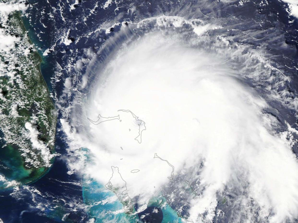 A handout photo made available by NASA shows a natural-color satellite image of Hurricane Dorian at 2:05 pm Eastern Daylight Time: EPA