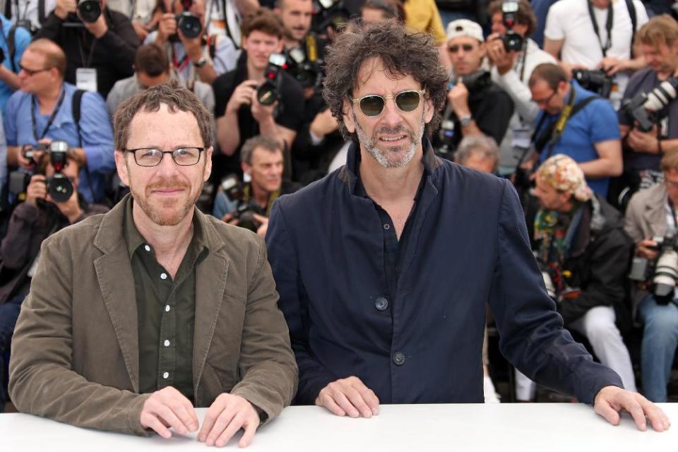 Directors Ethan Coen, left, and Joel Coen pose for photographers during a photo call for the film Inside Llewyn Davis at the 66th international film festival, in Cannes, southern France, Sunday, May 19, 2013. (Photo by Joel Ryan/Invision/AP)