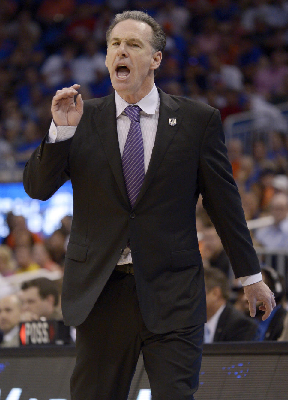 Pittsburgh head coach Jamie Dixon gestures during the first half in a third-round game in the NCAA college basketball tournament against Florida, Saturday, March 22, 2014, in Orlando, Fla. (AP Photo/Phelan M. Ebenhack)
