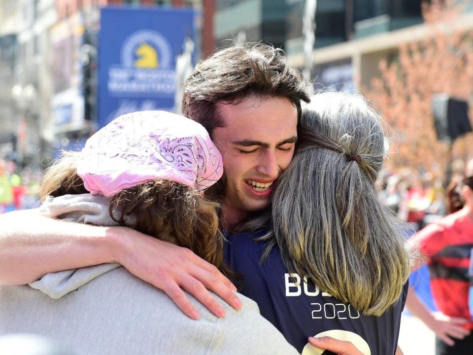Henry Richard is met by family at the finish of this year&#39;s Boston Marathon after running in honour of his brother, Martin, killed in 2013&#39;s bombing attack at the event. (USA Today - image credit)