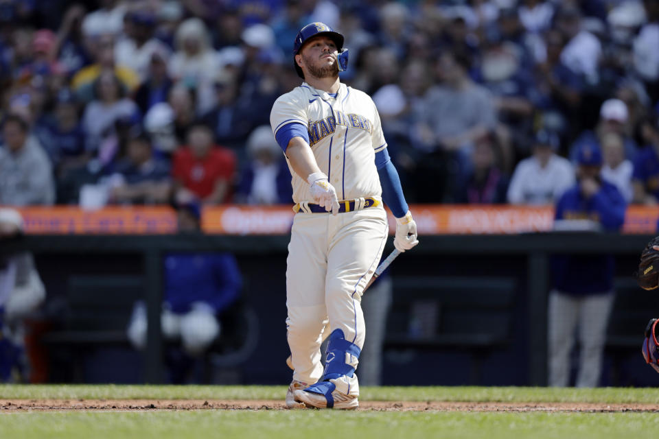 Seattle Mariners' Cal Raleigh reacts after striking out during the fifth inning of a baseball game against the Los Angeles Dodgers, Sunday, Sept. 17, 2023, in Seattle. (AP Photo/John Froschauer)