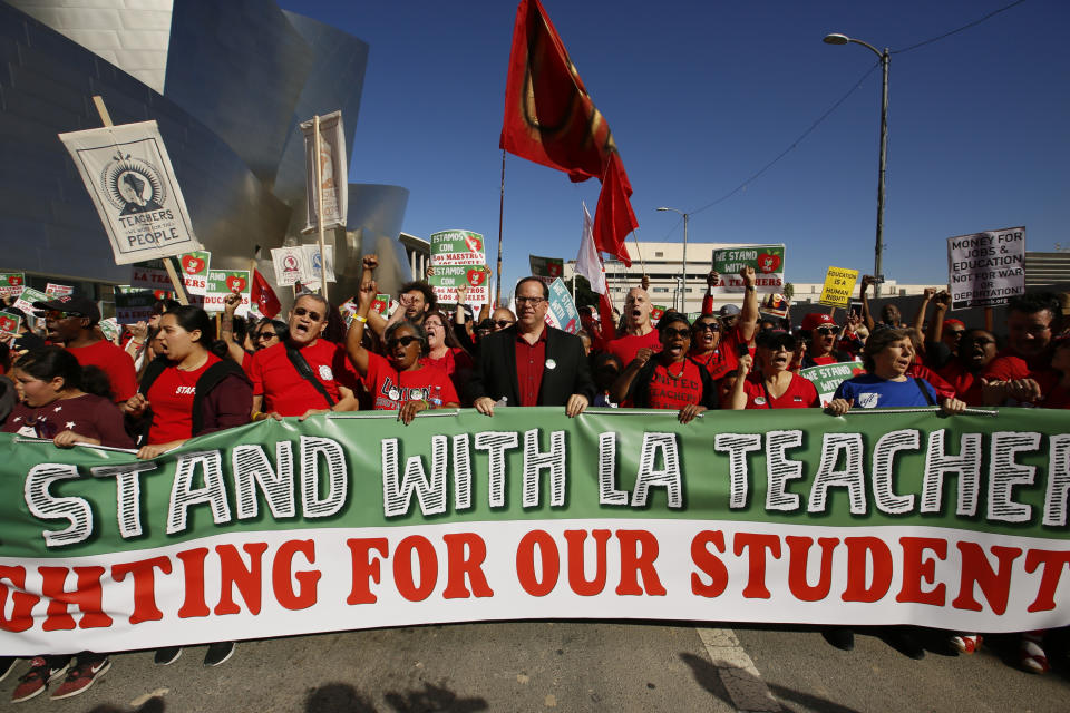 In this Saturday, Dec. 15, 2018, photo, thousands of teachers rally against the nation's second-largest school district in downtown Los Angeles. A massive teachers strike in Los Angeles is all but inevitable starting Monday, Jan. 14, 2019, after the two sides did not renew negotiations over the weekend. (AP Photo/Damian Dovarganes)