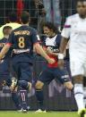 Paris Saint Germain's Edinson Cavani of Argentina, center, celebrates scoring against Olympic Lyonnais during the French League Cup Final soccer match at the Stade de France in Saint Denis, north of Paris, Saturday April 19, 2014. (AP Photo/Jacques Brinon)