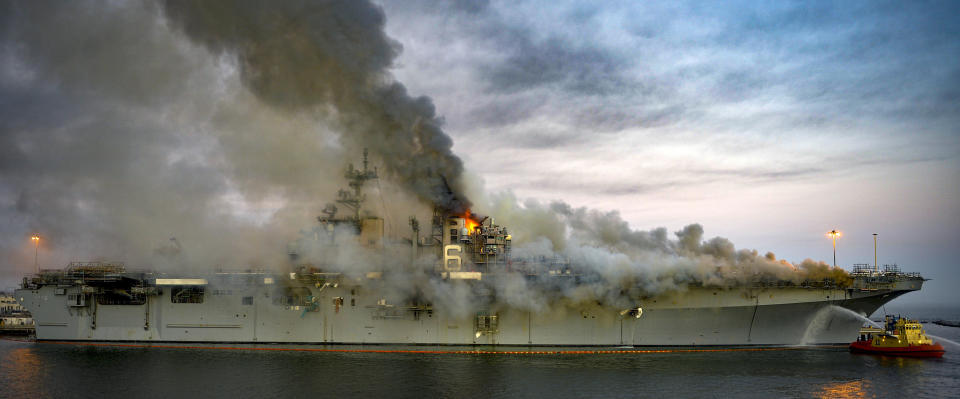 A fire continues to be fought into the evening on board USS Bonhomme Richard (LHD 6) at Naval Base San Diego, July 12, 2020 in San Diego, Califonia.  / Credit: Mass Communication Specialist 2nd Class Austin Haist/U.S. Navy via Getty Images