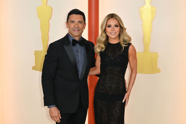 <p>ANGELA WEISS/AFP via Getty</p> Mark Consuelos and Kelly Ripa.