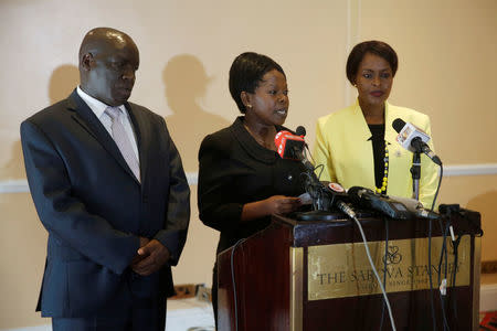 Kenyan commissioners Nkatha Maina (R), Margaret Mwachanya and Paul Kurgat from Kenya's Independent Electoral and Boundaries Commission (IEBC) attend a news conference where they announced their resignation in Nairobi, Kenya, April 16, 2018. REUTERS/Baz Ratner