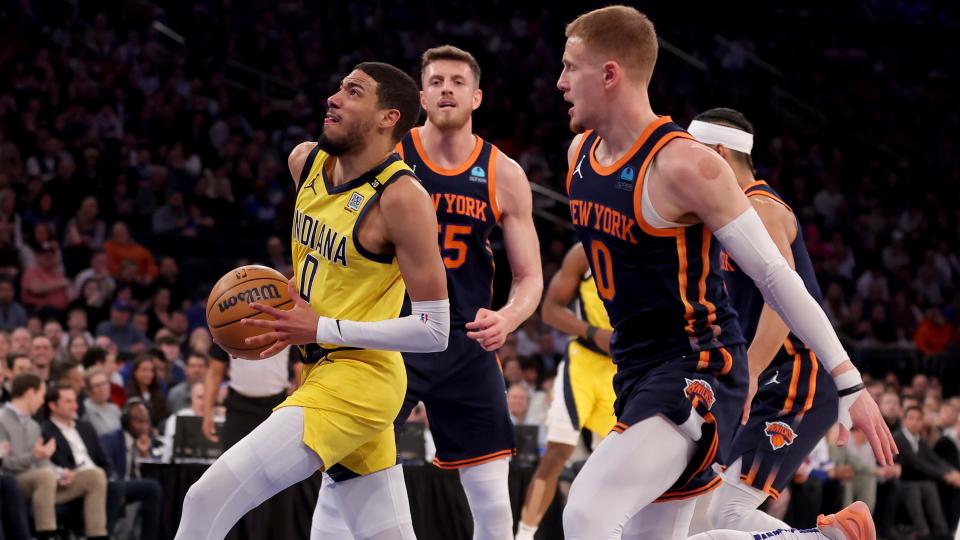 Indiana Pacers guard Tyrese Haliburton (0) drives to the basket against New York Knicks center Isaiah Hartenstein (55) and guard Donte DiVincenzo (0) during the first quarter at Madison Square Garden