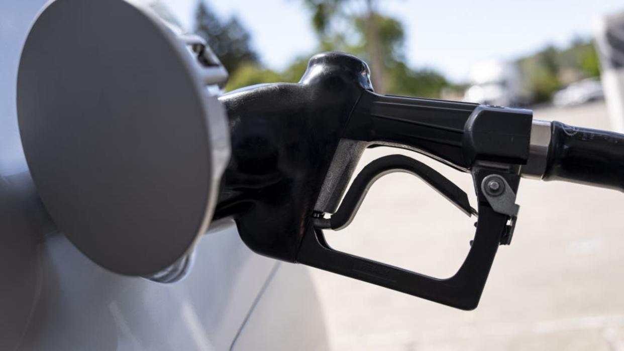 <div>A fuel nozzle in a car at a Chevron gas station in Pinole, California, U.S., on Wednesday, June 22, 2022. (Photographer: David Paul Morris/Bloomberg via Getty Images)</div>