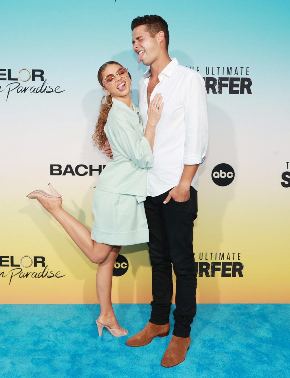 <p>Sarah Hyland and fiancé Wells Adams have tongues wagging (their own!) at the Aug. 12 <em>Bachelor in Paradise</em> and <em>The Ultimate Surfer</em> premiere at the Fairmont Miramar Hotel & Bungalows in Santa Monica. </p>