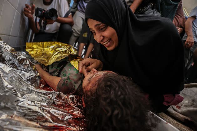 Palestinians mourn loved ones who died in Israeli attacks on the al-Maghazi refugee camp, at Al-aqsa Martyrs Hospital in Deir al-Balah, Gaza, on June 25, 2024. 