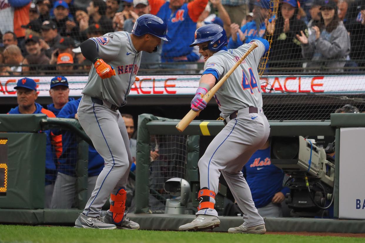 New York Mets right fielder Tyrone Tyler (15) celebrates with center fielder Harrison Bader (44) after hitting a solo home run against he San Francisco Giants during the fourth inning on April 24, 2024, at Oracle Park.