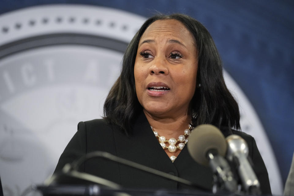 FILE - Fulton County District Attorney Fani Willis speaks in the Fulton County Government Center during a news conference, Monday, Aug. 14, 2023, in Atlanta. A judge on Friday, Sept. 8, is expected to release the full report compiled by a special grand jury that helped an investigation by the Georgia prosecutor who ultimately indicted former President Donald Trump and 18 others. (AP Photo/John Bazemore, File)