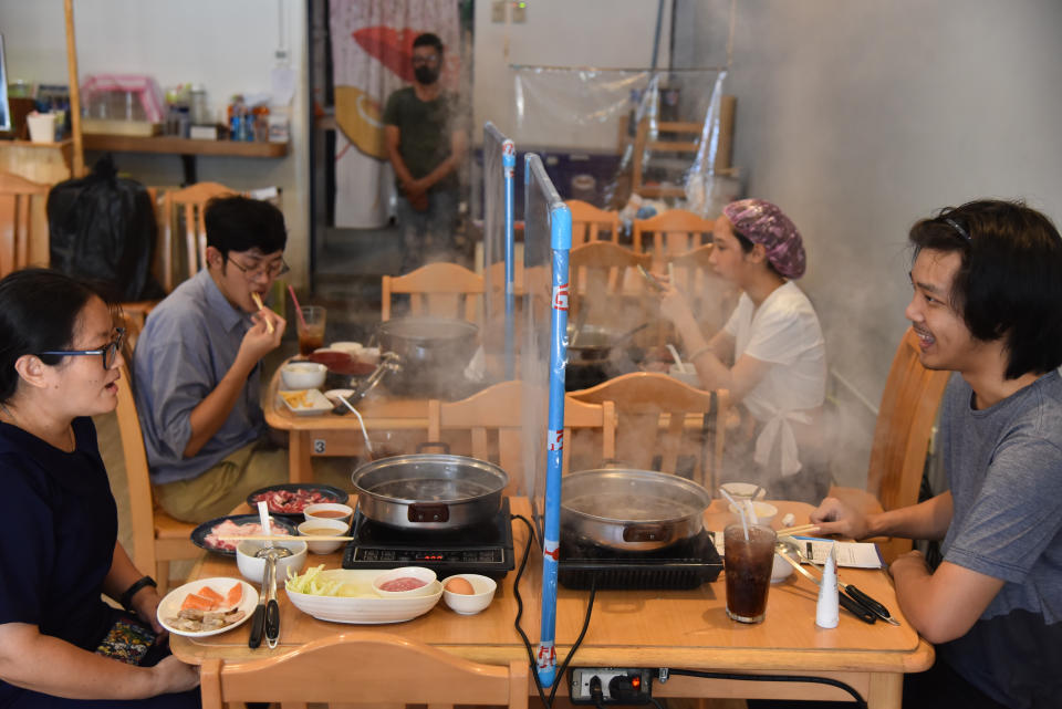 Customers lunch at Yujin Shabu hot pot restaurant in Bangkok, Thailand.