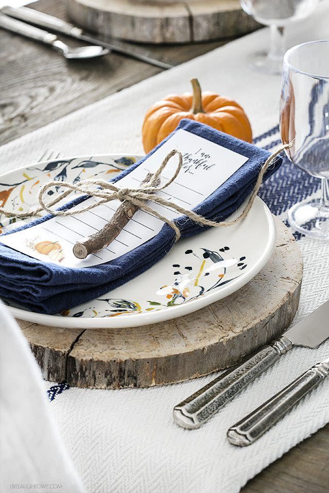 <p>Complete with a wood slab, pretty printed plate, and a printed "I'm Thankful For..." bookmark secured to each napkin with twine, this farmhouse table setting couldn't be cozier. </p><p><strong><em><a href="https://livelaughrowe.com/fall-tablescape-printable-bookmark/" rel="nofollow noopener" target="_blank" data-ylk="slk:Get the tutorial at Live Laugh Rowe;elm:context_link;itc:0;sec:content-canvas" class="link ">Get the tutorial at Live Laugh Rowe</a>. </em></strong></p><p><a class="link " href="https://www.amazon.com/Natural-Wrapping-String-Gardening-Applications/dp/B074N6PDZY?tag=syn-yahoo-20&ascsubtag=%5Bartid%7C10070.g.23289609%5Bsrc%7Cyahoo-us" rel="nofollow noopener" target="_blank" data-ylk="slk:SHOP TWINE;elm:context_link;itc:0;sec:content-canvas">SHOP TWINE</a></p>