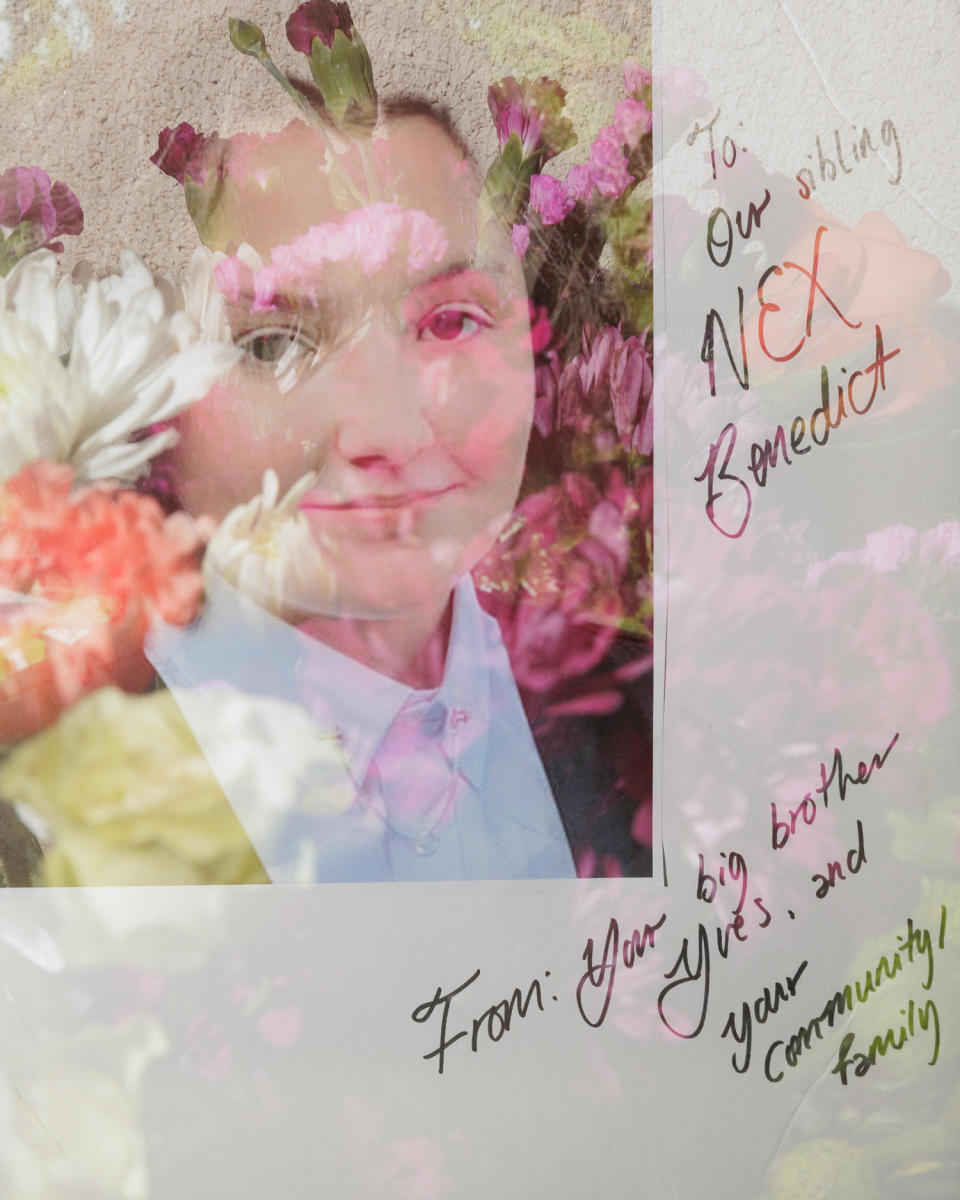 A photo of Nex Benedict with a note is left alongside flowers (Shelby Tauber for NBC News)