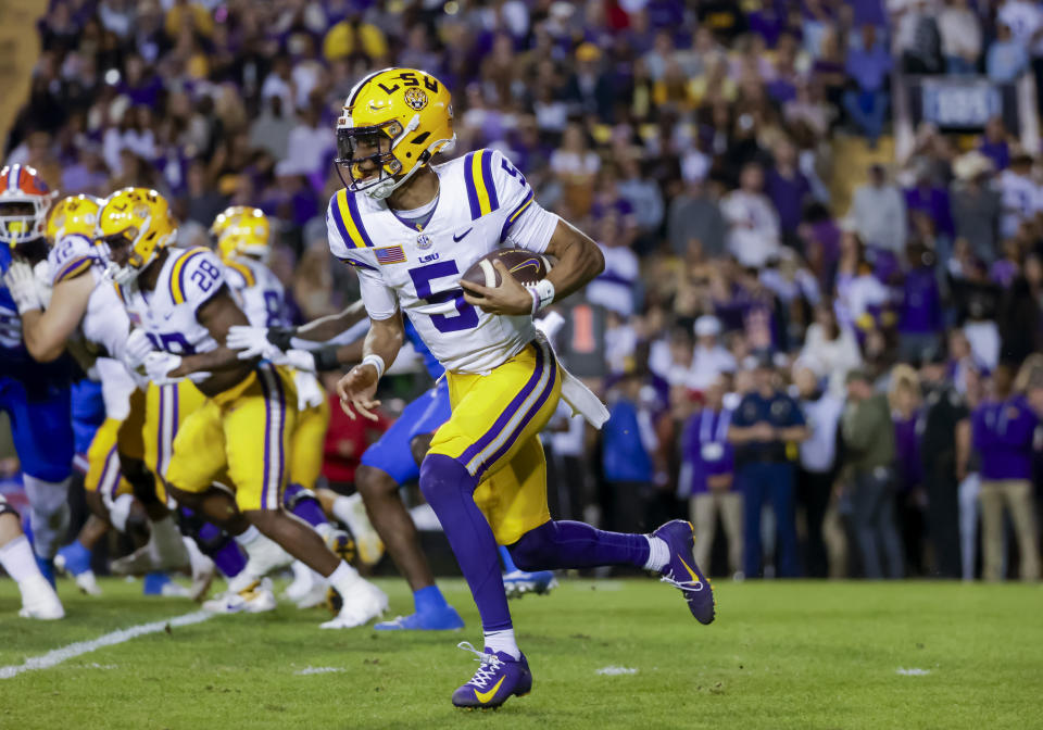 LSU quarterback Jayden Daniels (5) runs for a touchdown against Florida during the first half of an NCAA college football game in Baton Rouge, La., Saturday, Nov. 11, 2023. (AP Photo/Derick Hingle)