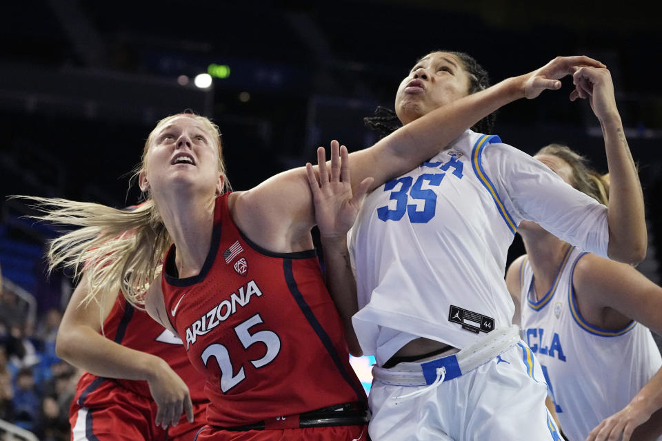 Arizona forward Cate Reese, left, and UCLA guard Camryn Brown battle for a rebound during overtime in an NCAA college basketball game Friday, Feb. 3, 2023, in Los Angeles. (AP Photo/Mark J. Terrill)