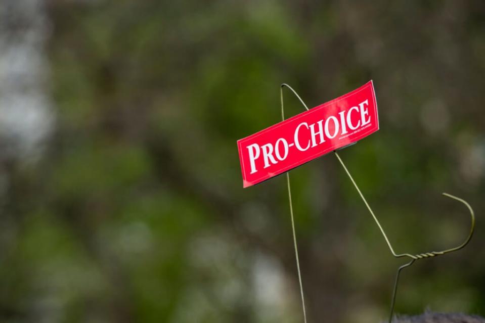 Protestor holds hanger after Roe v. Wade overturned