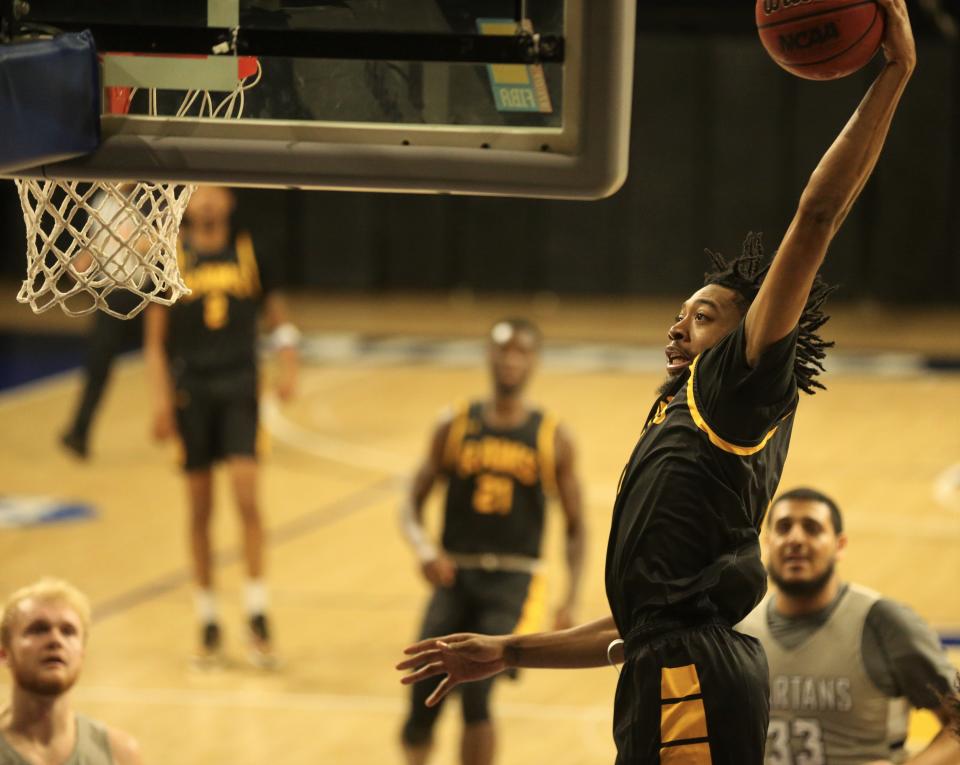 Angelo State University's Dante Moses goes up for a dunk against Missouri Baptist at the Ed Messbarger Classic on Friday, Nov. 26, 2021.