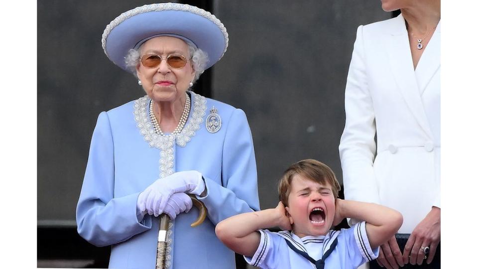 The Queen stood next to Prince Louis who is covering his ears