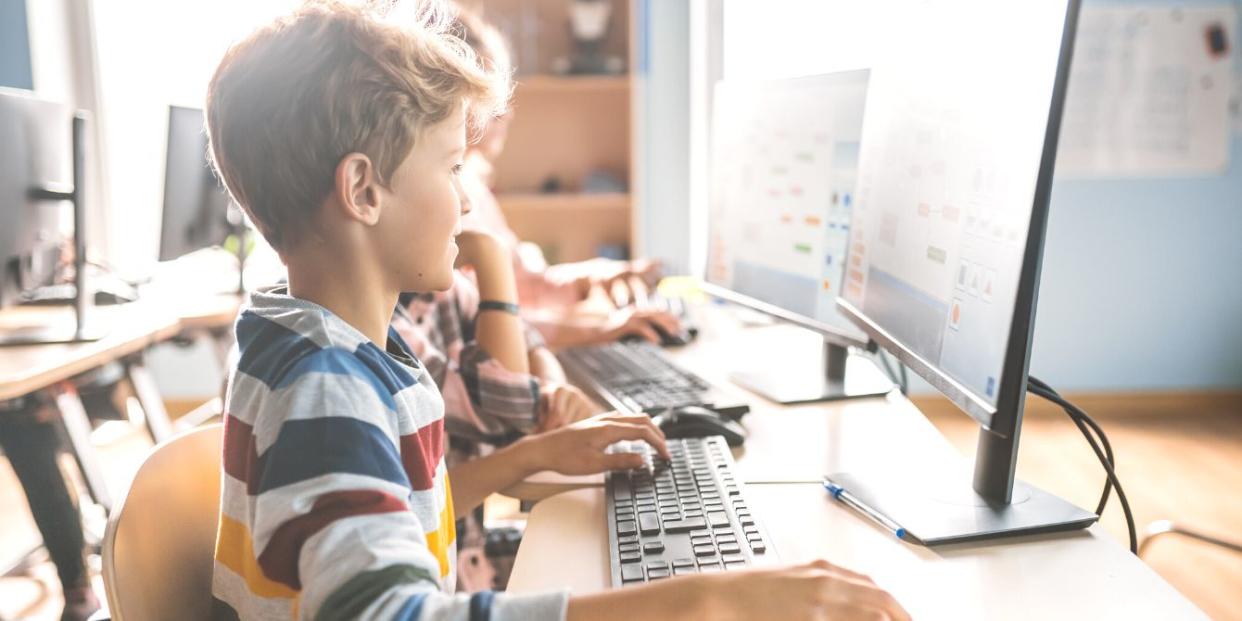 Young student in computer science class