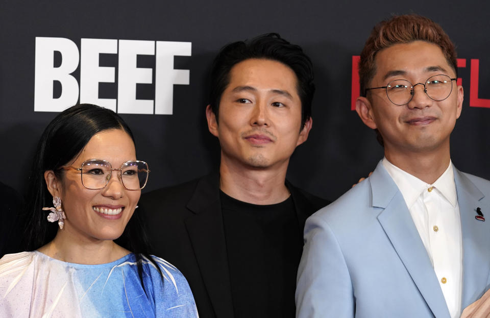 Lee Sung Jin, right, the creator/showrunner/executive producer/director of "Beef," poses with cast members Ali Wong, left, and Steven Yeun at the premiere of the Netflix series Thursday, March 30, 2023, at Tudum Theatre in Los Angeles. (AP Photo/Chris Pizzello)