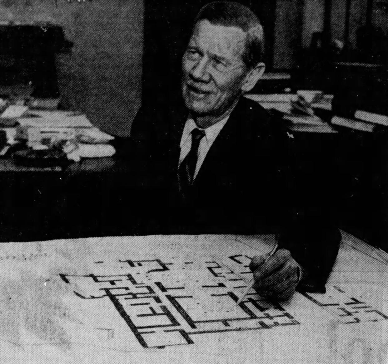 University of Cincinnati archaeologist Carl W. Blegen, shown with the plan of King Nestor’s palace in a 1956 photo, gained fame for helping excavate the ancient city of Troy in 1932.