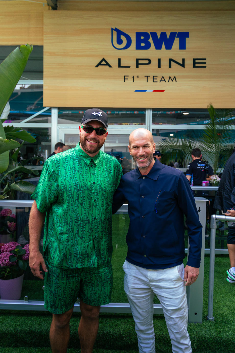 Travis Kelce, an investor in <a href="https://wwd.com/fashion-news/sportswear/palace-kappa-bwt-alpine-f1-capsule-1235922730/" rel="nofollow noopener" target="_blank" data-ylk="slk:Alpine;elm:context_link;itc:0;sec:content-canvas" class="link ">Alpine</a>, with Zinedine Zidane, CSR Alpine ambassador.