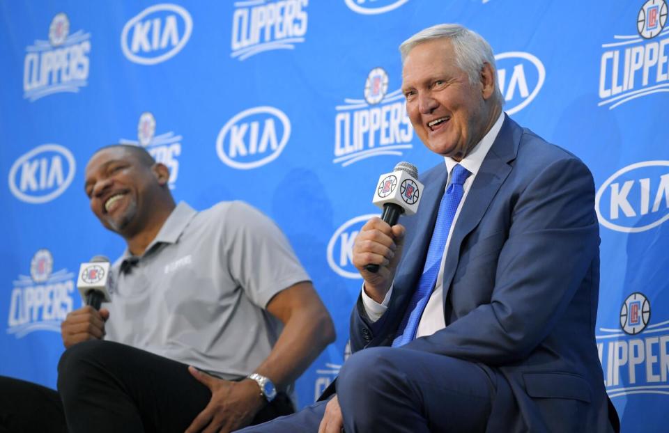 Jerry West speaks during the press conference as Clippers coach Doc Rivers sits next to him and smiles in 2017.