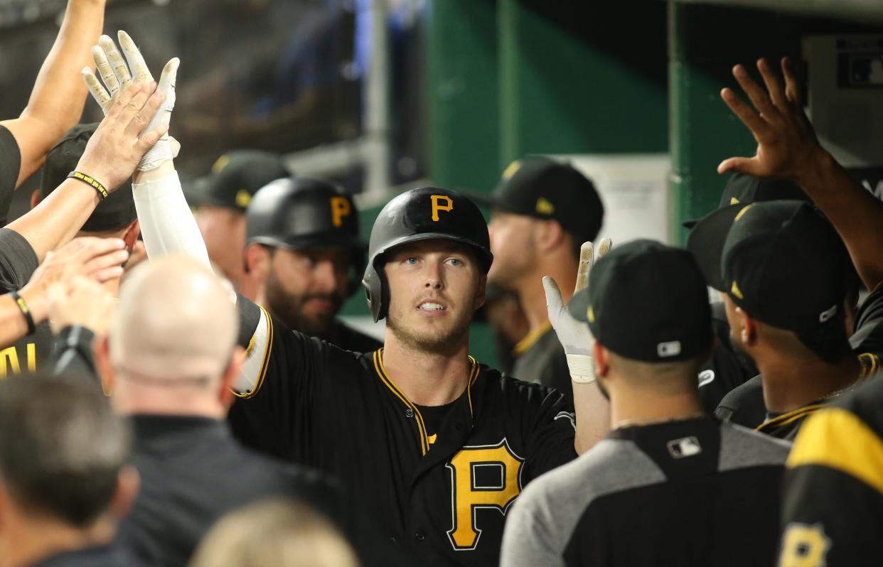 Sep 21, 2018; Pittsburgh, PA, USA;  Pittsburgh Pirates left fielder Corey Dickerson (12) is greeted after hitting a two run home run against the Milwaukee Brewers during the fourth inning at PNC Park. Mandatory Credit: Charles LeClaire-USA TODAY Sports